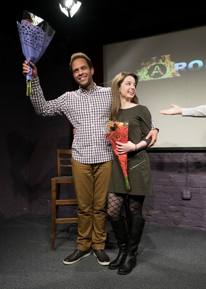 Jason Farr and Justina Sparling holding bouquets at Alchemy Theater.